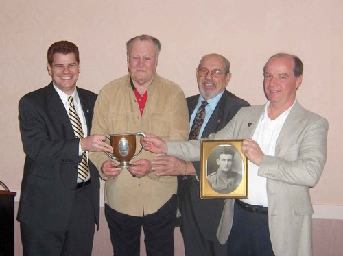 Emery Currier Presents Cup to Past and Present Race Directors. (Shown L to R: Doug Lucente, Emery Currier, John Lucente, Jim Shimansky)